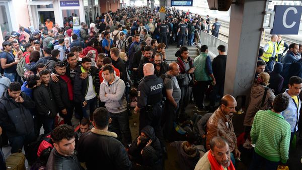 Refugees wait for a special train at the train station in Freilassing, near the Austrian-German border, southern Germany, on September 15, 2015 - Sputnik International