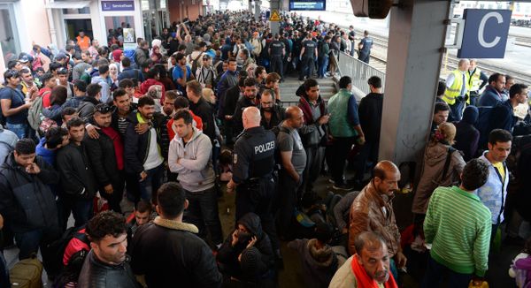 Refugees wait for a special train at the train station in Freilassing, near the Austrian-German border, southern Germany Refugees wait for a special train at the train station in Freilassing, near the Austrian-German border, southern Germany - Sputnik International