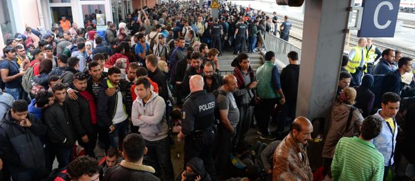 Refugees wait for a special train at the train station in Freilassing, near the Austrian-German border, southern Germany - Sputnik International