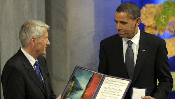 US President Barack Obama, right is applauded by Nobel Committee Chairman Thorbjorn Jagland after receiving the Nobel Peace Prize during a ceremony in the Main Hall of Oslo City Hall in Oslo, Norway. (File) - Sputnik International