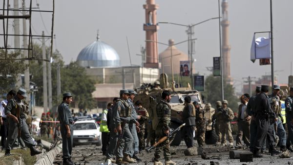 Afghan security personnel keep watch at the site of a suicide car bomb blast in Kabul, Afghanistan October 11, 2015 Afghan security personnel keep watch at the site of a suicide car bomb blast in Kabul, Afghanistan October 11, 2015 - Sputnik International
