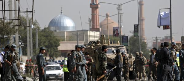 Afghan security personnel keep watch at the site of a suicide car bomb blast in Kabul, Afghanistan October 11, 2015 Afghan security personnel keep watch at the site of a suicide car bomb blast in Kabul, Afghanistan October 11, 2015 - Sputnik International