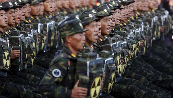 Soldiers shout slogans towards a stand with North Korean leader Kim Jong Un and other officials during the parade celebrating the 70th anniversary of the founding of the ruling Workers' Party of Korea, in Pyongyang October 10, 2015 - Sputnik International