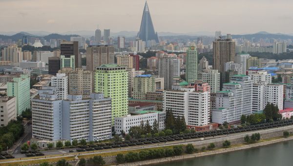 Military vehicles line up on a road in Pyongyang on October 10, 2015 - Sputnik International