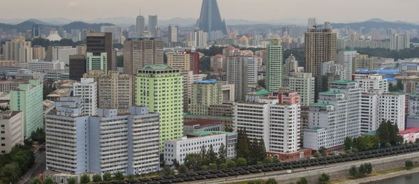 Military vehicles line up on a road in Pyongyang on October 10, 2015 - Sputnik International