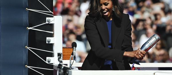 Michelle Obama at solemn ceremony of launching a new Navy submarine at a shipyard in Connecticut. - Sputnik International