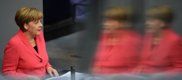 German Chancellor Angela Merkel addresses the Bundestag, the lower house of parliament in Berlin on September 24, 2015. Merkel said that a European Union deal to relocate 120,000 refugees was far from what was necessary to resolve the biggest migrant crisis facing the region since World War II. German Chancellor Angela Merkel addresses the Bundestag, the lower house of parliament in Berlin on September 24, 2015. Merkel said that a European Union deal to relocate 120,000 refugees was far from what was necessary to resolve the biggest migrant crisis facing the region since World War II. - Sputnik International
