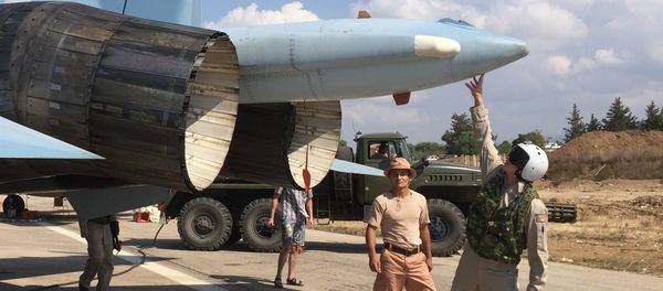 Russian pilots ready a Su-30 fighter for a raid at Hmeimim aerodrome in Syria. Russian pilots ready a Su-30 fighter for a raid at Hmeimim aerodrome in Syria. - Sputnik International