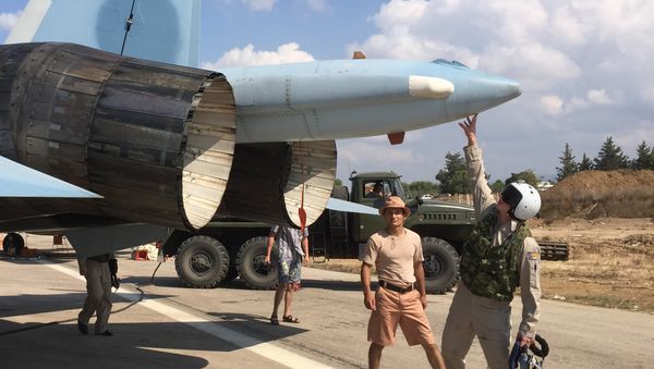 Russian pilots ready a Su-30 fighter for a raid at Hmeimim aerodrome in Syria. Russian pilots ready a Su-30 fighter for a raid at Hmeimim aerodrome in Syria. - Sputnik International