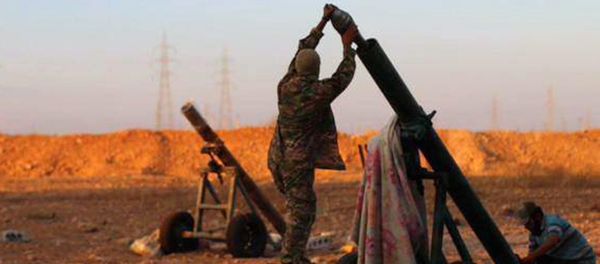 In this image posted on Thursday, Oct. 8, 2015, by the Rased News Network, a Facebook page affiliated with Islamic State, shows Islamic State militants preparing to fire a mortar to shell towards Syrian government forces positions at Tal Arn in Aleppo province, Syria - Sputnik International