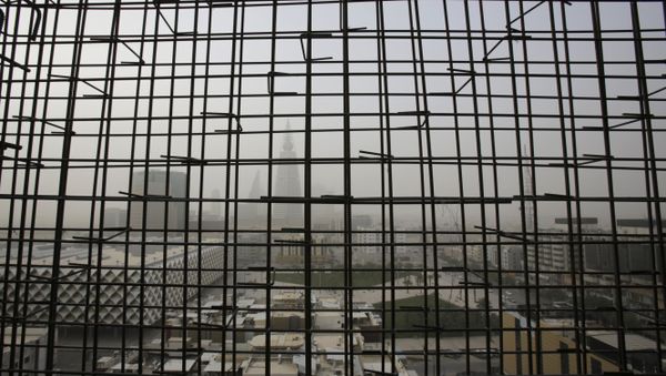 Al-Faisaliya tower is seen through metal bars from a nearby building under construction, during a sand storm in Riyadh, Saudi Arabia, Friday, April 25, 2015. Al-Faisaliya tower is seen through metal bars from a nearby building under construction, during a sand storm in Riyadh, Saudi Arabia, Friday, April 25, 2015. - Sputnik International