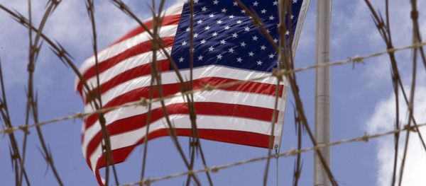 A US flag flies in this April 24 2007 file photo at Camp V inside Camp Delta at the US Naval Station in Guantanamo Bay, Cuba A US flag flies in this April 24 2007 file photo at Camp V inside Camp Delta at the US Naval Station in Guantanamo Bay, Cuba - Sputnik International
