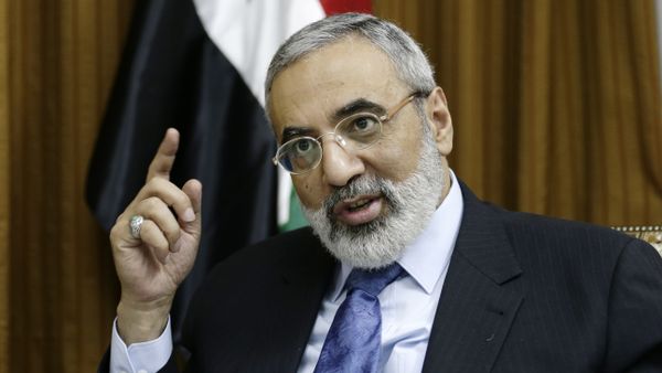 Syrian Information Minister Omran al-Zoubi speaks during an interview with the Associated Press at his office, in Damascus, Syria, Sunday, Aug. 25, 2013 - Sputnik International