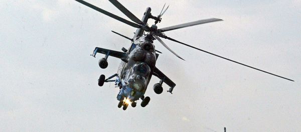 Mi-24 helicopter gunships of Berkuty (Golden Eagles) Russian aerobatic team perform during the Flying Legend. Mi-24 helicopter gunships of Berkuty (Golden Eagles) Russian aerobatic team perform during the Flying Legend. - Sputnik International