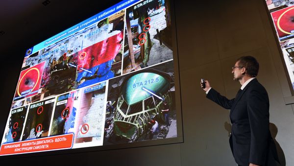 An official of Russia's missile maker Almaz-Antey presents the results of the company’s investigation into the downing of Malaysia Airlines flight MH17 at a press conference in Moscow on October 13, 2015 - Sputnik International