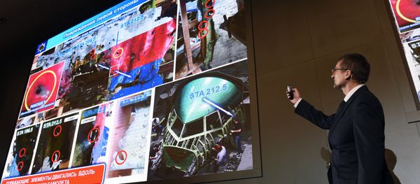 An official of Russia's missile maker Almaz-Antey presents the results of the company’s investigation into the downing of Malaysia Airlines flight MH17 at a press conference in Moscow on October 13, 2015 - Sputnik International