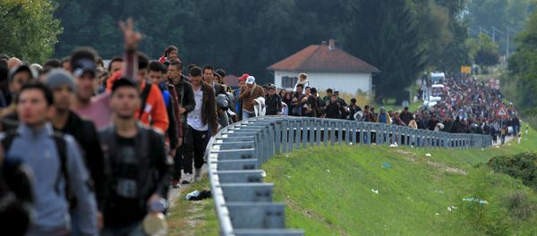 Migrants walk towards the Hungarian border after arriving at the train station in Botovo, Croatia October 6, 2015 Migrants walk towards the Hungarian border after arriving at the train station in Botovo, Croatia October 6, 2015 - Sputnik International