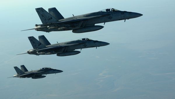 This US Air Forces Central Command file photo released by the Defense Video & Imagery Distribution System (DVIDS) shows a formation of US Navy F-18E Super Hornets in flight after receiving fuel from a KC-135 Stratotanker over northern Iraq, on September 23, 2014 This US Air Forces Central Command file photo released by the Defense Video & Imagery Distribution System (DVIDS) shows a formation of US Navy F-18E Super Hornets in flight after receiving fuel from a KC-135 Stratotanker over northern Iraq, on September 23, 2014 - Sputnik International