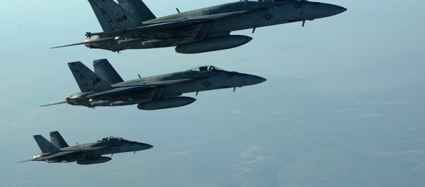 This US Air Forces Central Command file photo released by the Defense Video & Imagery Distribution System (DVIDS) shows a formation of US Navy F-18E Super Hornets in flight after receiving fuel from a KC-135 Stratotanker over northern Iraq, on September 23, 2014 - Sputnik International