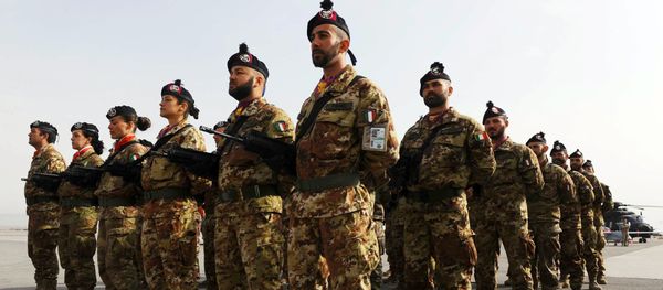 Italian soldiers stand to attention during a change of command ceremony at an Italian military camp near Herat airport. File photo Italian soldiers stand to attention during a change of command ceremony at an Italian military camp near Herat airport. File photo - Sputnik International