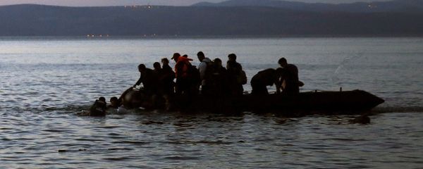 Afghan migrants try to hold onto a sinking dinghy off the Greek island of Lesbos after crossing a part of the Aegean Sea from Turkey to Lesbos. Afghan migrants try to hold onto a sinking dinghy off the Greek island of Lesbos after crossing a part of the Aegean Sea from Turkey to Lesbos. - Sputnik International