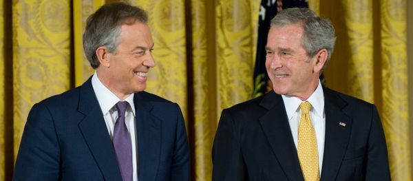 Former US President George W. Bush smiles alongside former British Prime Minister Tony Blair. - Sputnik International