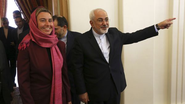 Iranian Foreign Minister Mohammad Javad Zarif, right, gestures with European Union foreign policy chief Federica Mogherini. Iranian Foreign Minister Mohammad Javad Zarif, right, gestures with European Union foreign policy chief Federica Mogherini. - Sputnik International