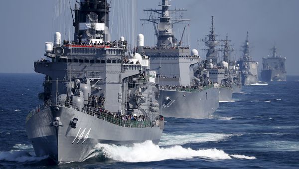 Japan Maritime Self-Defense Force (JMSDF) destroyer Kurama (L), which is carrying Japan's Prime Minister Shinzo Abe, leads the JMSDF fleet during its fleet review at Sagami Bay, off Yokosuka, south of Tokyo - Sputnik International