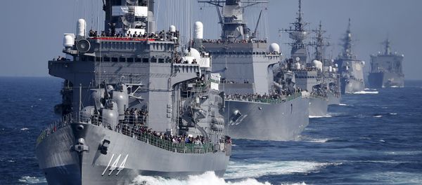Japan Maritime Self-Defense Force (JMSDF) destroyer Kurama (L), which is carrying Japan's Prime Minister Shinzo Abe, leads the JMSDF fleet during its fleet review at Sagami Bay, off Yokosuka, south of Tokyo Japan Maritime Self-Defense Force (JMSDF) destroyer Kurama (L), which is carrying Japan's Prime Minister Shinzo Abe, leads the JMSDF fleet during its fleet review at Sagami Bay, off Yokosuka, south of Tokyo - Sputnik International