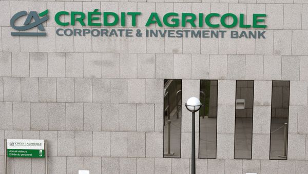 Logo of French banking group Credit Agricole's Corporate and Investment Bank in La Defense District near Paris Logo of French banking group Credit Agricole's Corporate and Investment Bank in La Defense District near Paris - Sputnik International