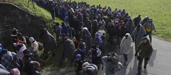 A group of migrants continue their journey near Dobova, Slovenia October 20, 2015 A group of migrants continue their journey near Dobova, Slovenia October 20, 2015 - Sputnik International