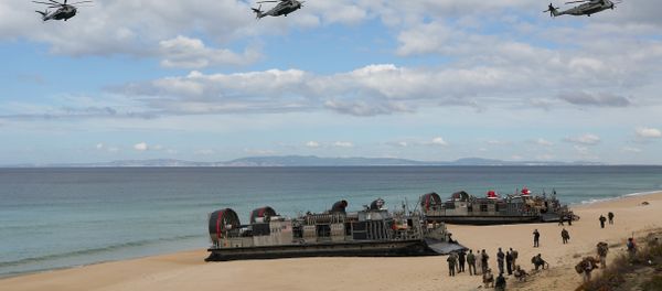 A file photo showing US navy helicopters fly over US Navy hovercraft during the NATO Trident Juncture exercise 2015. A file photo showing US navy helicopters fly over US Navy hovercraft during the NATO Trident Juncture exercise 2015. - Sputnik International