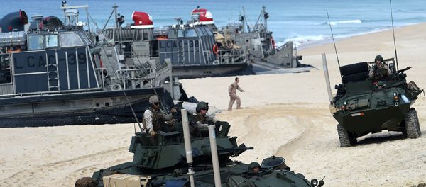 US marines disembark their armoured vehicles from the overcrafts deploid by the USS Arlington amphibious transport dock during the NATO's Trident Juncture exercise at Pinheiro da Cruz beach, south of Lisbon, near Grandola on October 20, 2015 US marines disembark their armoured vehicles from the overcrafts deploid by the USS Arlington amphibious transport dock during the NATO's Trident Juncture exercise at Pinheiro da Cruz beach, south of Lisbon, near Grandola on October 20, 2015 - Sputnik International