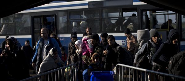 People get out of a bus in front of a registration center for migrants and refugees in Opatovac, Croatia, Wednesday, Oct. 21, 2015 People get out of a bus in front of a registration center for migrants and refugees in Opatovac, Croatia, Wednesday, Oct. 21, 2015 - Sputnik International