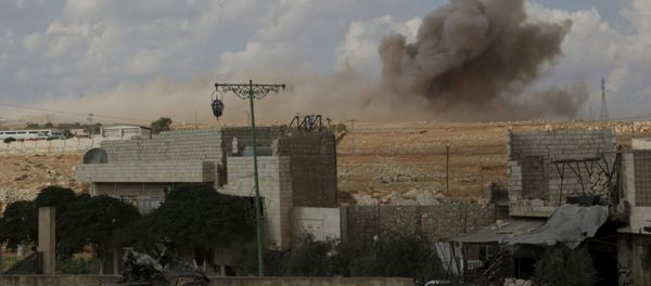 Smoke rises after what activists said were cluster bombs dropped by the Russian air force in Maaret al-Naaman town in Idlib province, Syria October 7, 2015 - Sputnik International