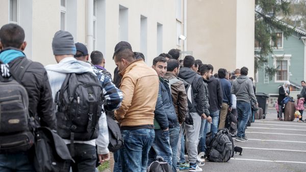 (File) Asylum seekers arrive at a refugee reception centre in the northern town of Tornio, Finland September 25, 2015 - Sputnik International