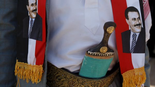 A man wears images of Yemen's former President Ali Abdullah Saleh during a demonstration against the Saudi-led air strikes outside the United Nations offices in Yemen's capital Sanaa October 18, 2015 A man wears images of Yemen's former President Ali Abdullah Saleh during a demonstration against the Saudi-led air strikes outside the United Nations offices in Yemen's capital Sanaa October 18, 2015 - Sputnik International