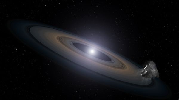 This is an artist’s impression of a white dwarf (burned-out) star accreting rocky debris left behind by the star’s surviving planetary system. It was observed by Hubble in the Hyades star cluster. At lower right, an asteroid can be seen falling toward a Saturn-like disk of dust that is encircling the dead star. Infalling asteroids pollute the white dwarf’s atmosphere with silicon. - Sputnik International