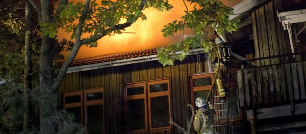 Firefighters battle a fire at Furulid School in Kungsbacka, south of Goteborg, Sweden, October 18, 2015 Firefighters battle a fire at Furulid School in Kungsbacka, south of Goteborg, Sweden, October 18, 2015 - Sputnik International