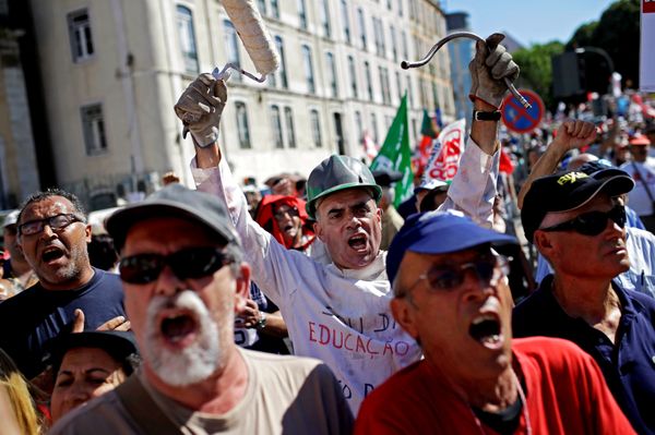 People shout slogans outside the Portuguese parliament during a protest by Portugal's main union CGTP, General Confederation of the Portuguese Workers, against cuts in salaries and pensions and others austerity measures taken by the government, in Lisbon, Thursday, July 10, 2014.  - Sputnik International