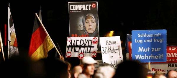 Supporters of the right-wing Alternative for Germany (AfD) demonstrate against the German government's new policy for migrants, in Erfurt, Germany October 21, 2015 - Sputnik International