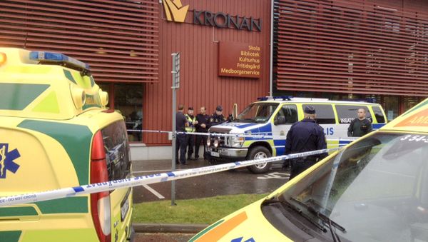 Police cordon off an area after a masked man attacked people with a sword at a school in Trollhattan, western Sweden October 22, 2015 Police cordon off an area after a masked man attacked people with a sword at a school in Trollhattan, western Sweden October 22, 2015 - Sputnik International