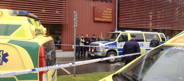 Police cordon off an area after a masked man attacked people with a sword at a school in Trollhattan, western Sweden October 22, 2015 - Sputnik International
