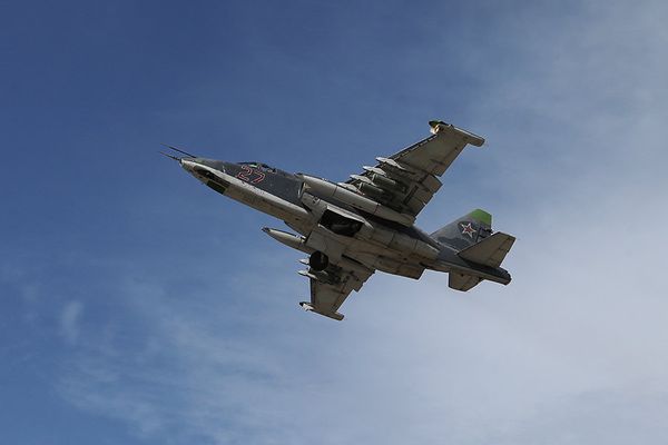 Russian Su-25SM Frogfoot-A heavy ground attack aircraft taking off at Hmeymim air base near Latakia, Syria. The aircraft is armed with OFAB-250-270 high-explosive fragmentation bombs (paired), BetAB-500 concrete-piercing bombs (attached near fuselage) and a GSh-30-2 dual-barrel automatic cannon (under cockpit). - Sputnik International