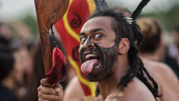 A Mauri indigenous man from New Zealand dances around a bonfire on the eve of the beginning of the first World Indigenous Games in Palmas, Tocantins, Brazil on October 22, 2015 - Sputnik International