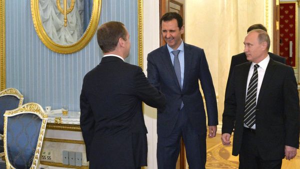 October 20, 2015. President Vladimir Putin, President of Syria Bashar al-Assad and Prime Minister Dmitry Medvedev (right to left) at a meeting at the Kremlin October 20, 2015. President Vladimir Putin, President of Syria Bashar al-Assad and Prime Minister Dmitry Medvedev (right to left) at a meeting at the Kremlin - Sputnik International