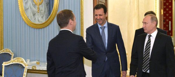 October 20, 2015. President Vladimir Putin, President of Syria Bashar al-Assad and Prime Minister Dmitry Medvedev (right to left) at a meeting at the Kremlin - Sputnik International
