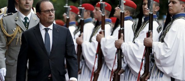 French President Francois Hollande inspects a guard of honour with his Greek counterpart Prokopis Pavlopoulos (not pictured) at a welcome ceremony in Athens, Greece, October 22, 2015. Hollande is paying a two-day official visit to Greece. - Sputnik International
