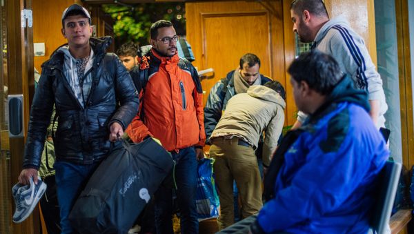 Refugee's arrive to Stockholm central mosque on October 15, 2015 after many hours bus journey from the southern city of Malmo Refugee's arrive to Stockholm central mosque on October 15, 2015 after many hours bus journey from the southern city of Malmo - Sputnik International
