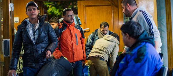 Refugee's arrive to Stockholm central mosque on October 15, 2015 after many hours bus journey from the southern city of Malmo Refugee's arrive to Stockholm central mosque on October 15, 2015 after many hours bus journey from the southern city of Malmo - Sputnik International